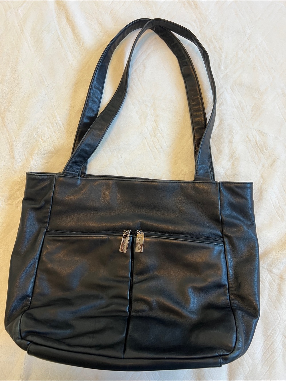 Tignanello Black Leather Shoulder Tote with outside pockets.